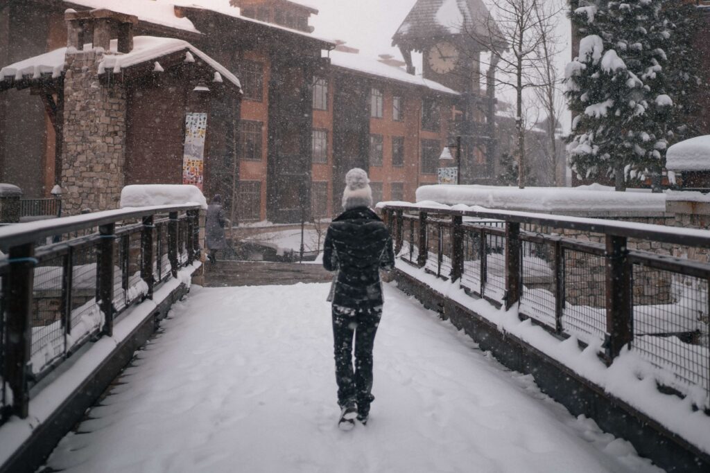 A woman walking in Mammoth Lakes during Winter.