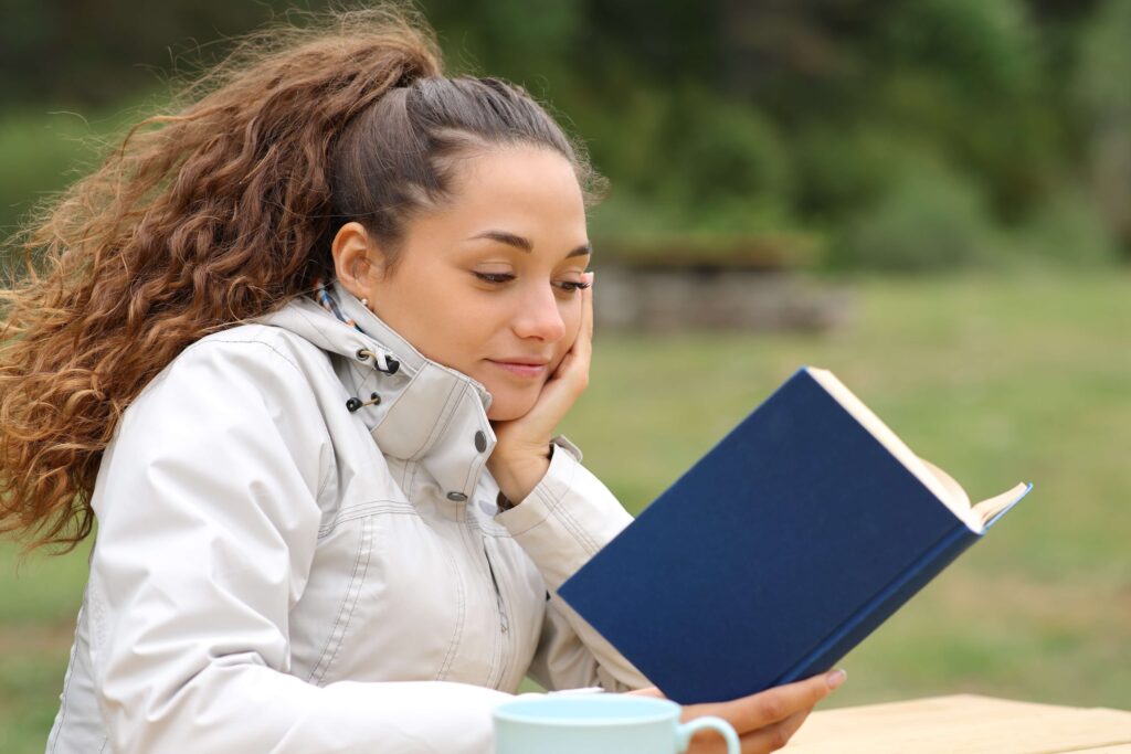 A woman reading about Things To Do Before Going On Vacation.